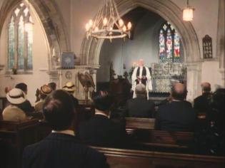 Why Didn’t They Ask Evans? Article Photo - Sir John Gielgud as the Vicar of Marchbolt, welcoming his congregation inside St Nicholas’ Church