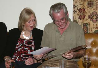 John and Elaine admiring their “Good Luck” card