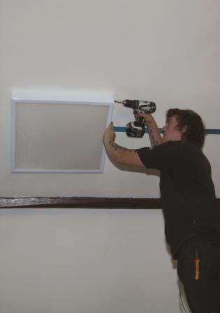 Refit for the Bernard Hall Article Photo - One of the new LED panels being installed