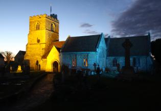 Church Floodlit in Blue and Yellow Article Photo - 